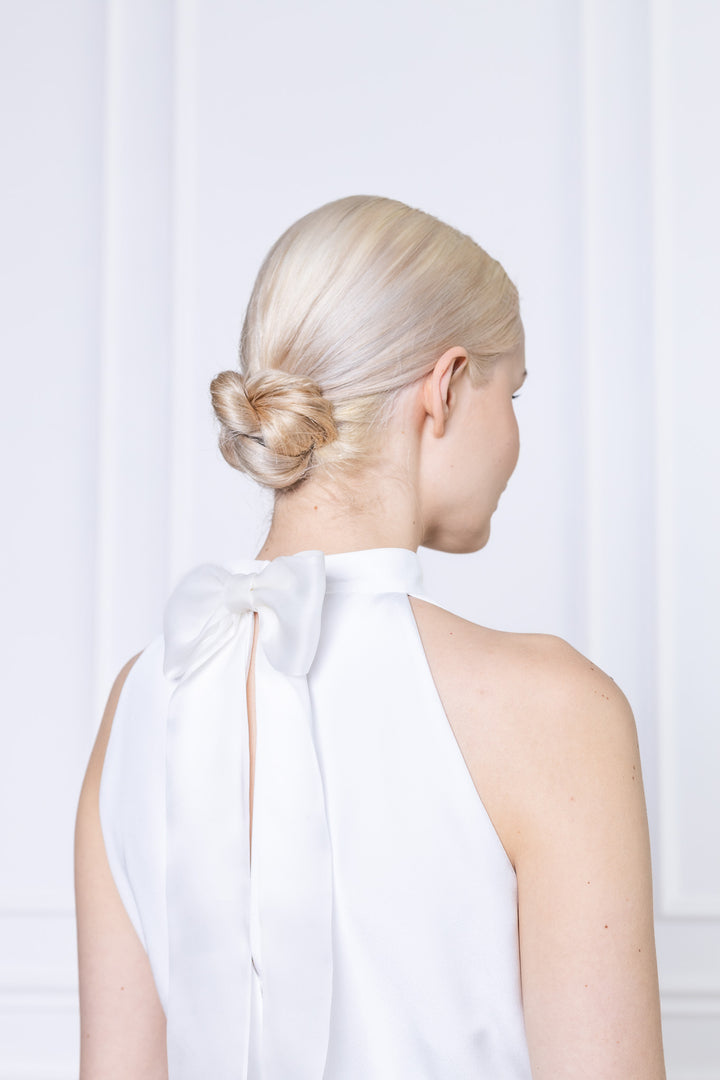 CLUSIA WHITE SILK HALTER NECK PEPLUM TOP WITH BOW DETAIL