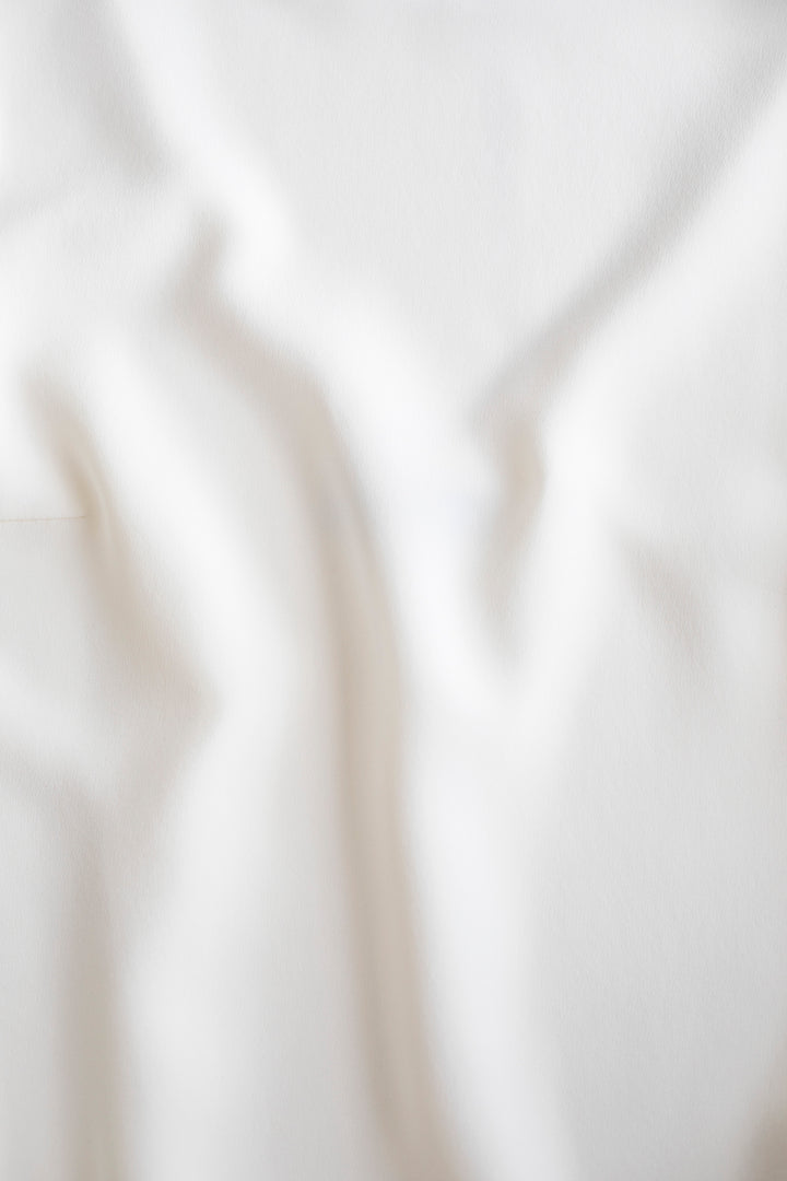 STELLARIA IVORY SILK WRAP BLOUSE