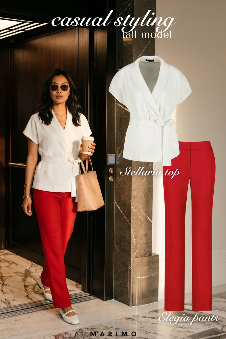 AI generated woman wearing a white  wrap top and red tailored pants with text overlay "casual styling" on a neutral luxurious background