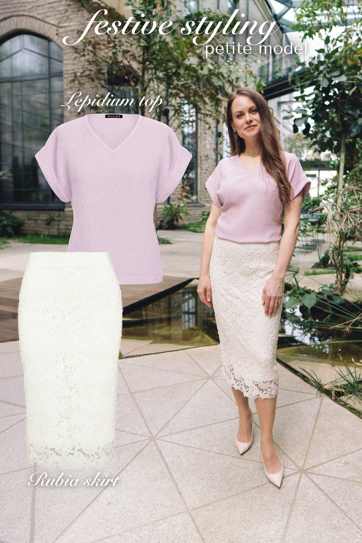 Petite woman wearing a lavender silk top and white lace skirt in a festive outdoor venue with product photos of the top and skirt next to her.