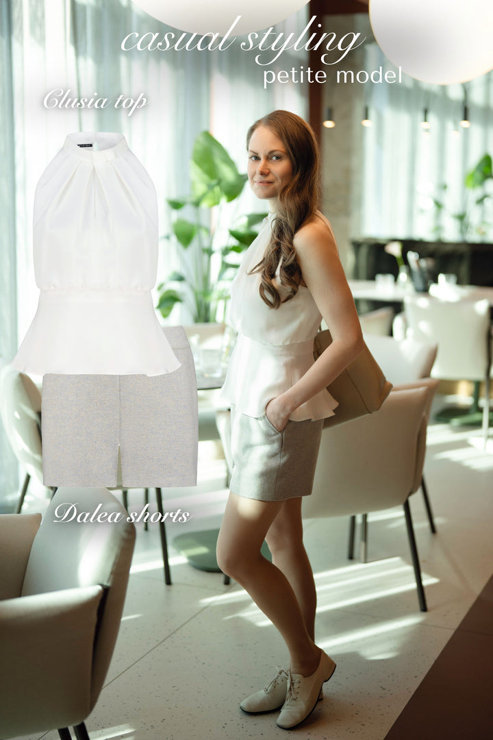 CLUSIA WHITE SILK HALTER NECK PEPLUM TOP WITH BOW DETAIL
