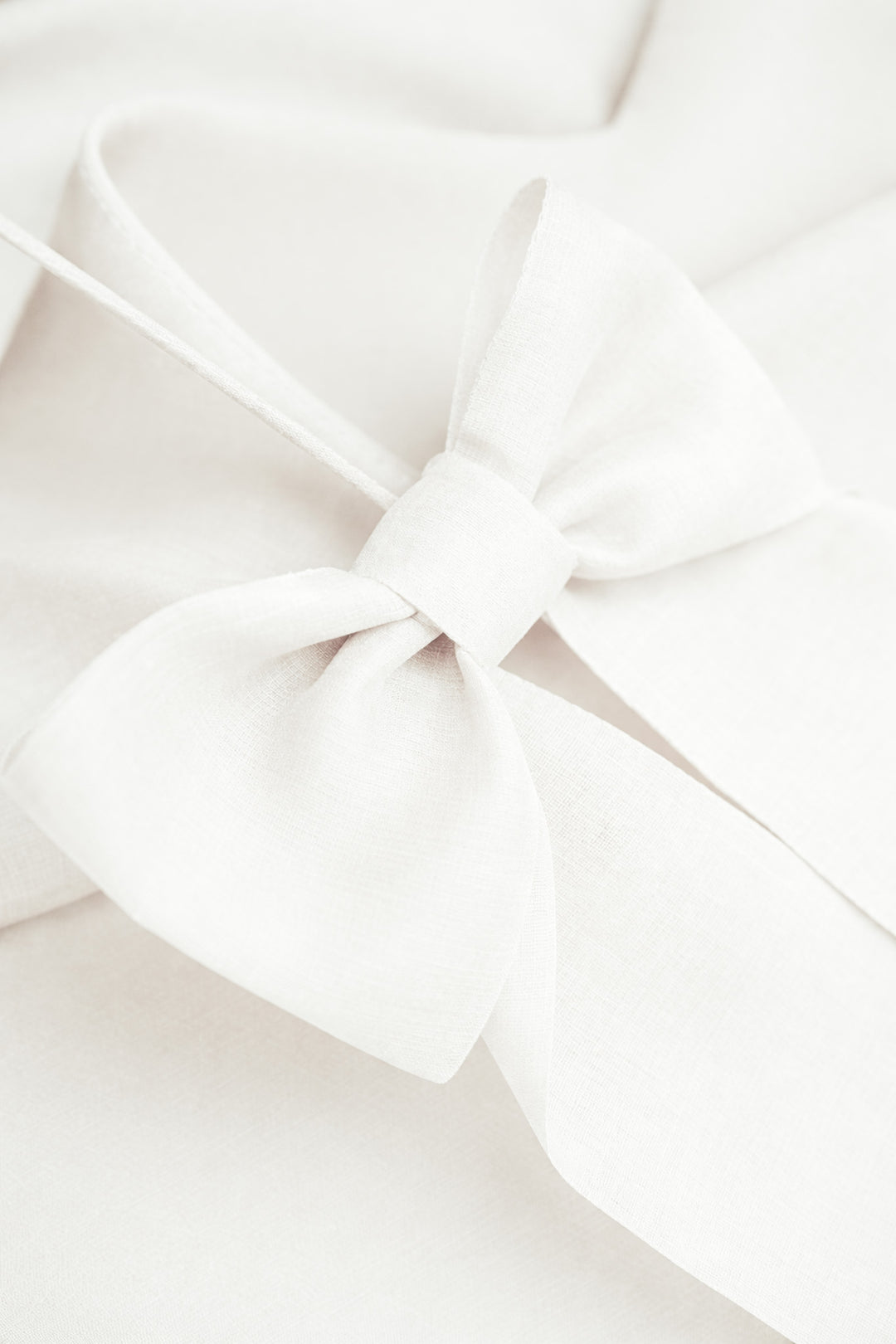 ARIA IVORY SPAGHETTI STRAP SILK TOP WITH BOW DETAILS