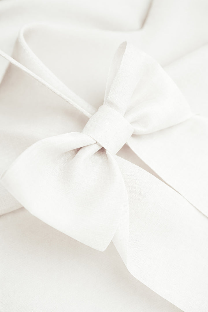 ARIA IVORY SPAGHETTI STRAP SILK TOP WITH BOW DETAILS