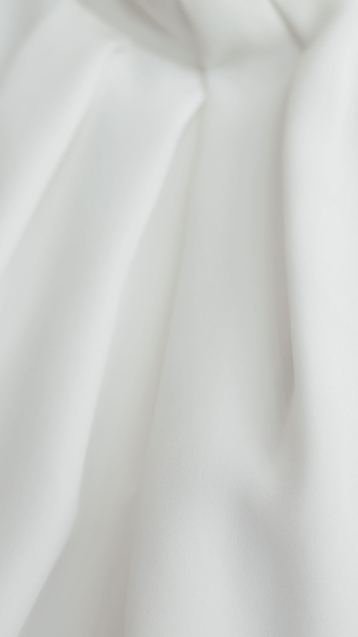 CLUSIA WHITE SILK HALTER NECK PEPLUM TOP WITH BOW DETAIL