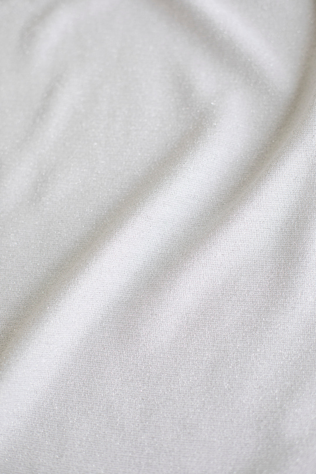 PHYMOSIA SILVER WHITE SLIGHTLY GLITTERING STRETCHY VISCOSE-BLEND WRAP BLOUSE